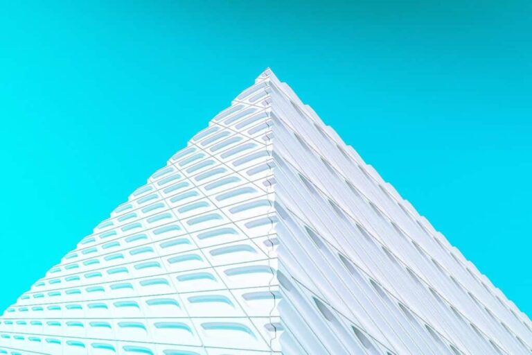 Scenic view of Lake Michigan Wines modern winery building with vibrant blue sky.